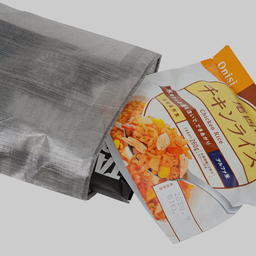 Gray ultralight Dyneema flat pouch holding trail food packages
