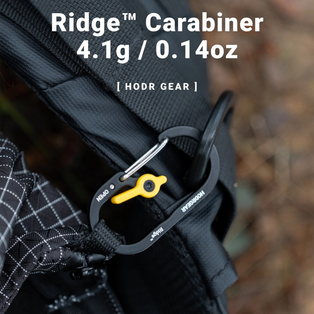 RIDGE Ultralight Utility Carabiner in use on a pack strap