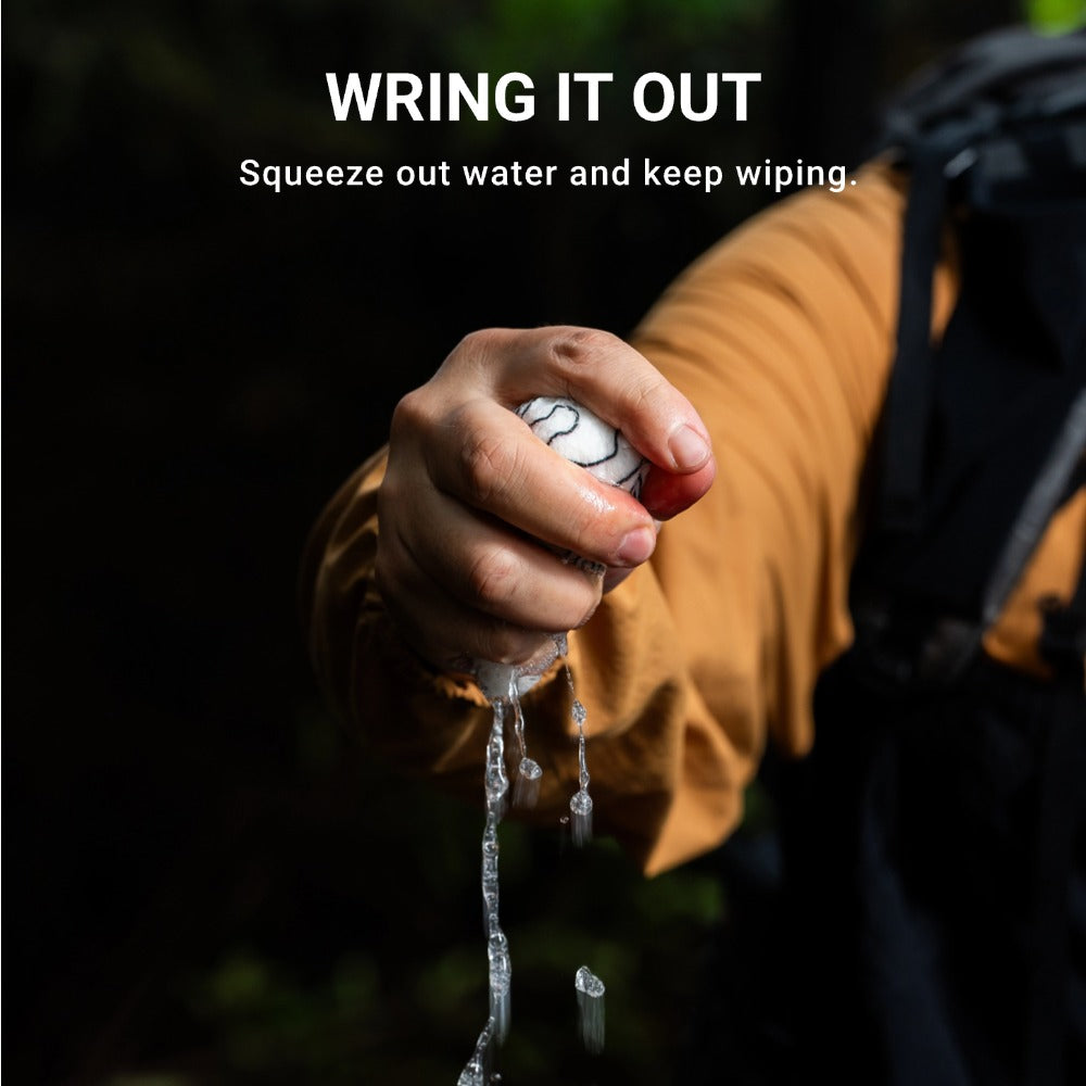 Tent Condensation Sponge wringing out water by hand