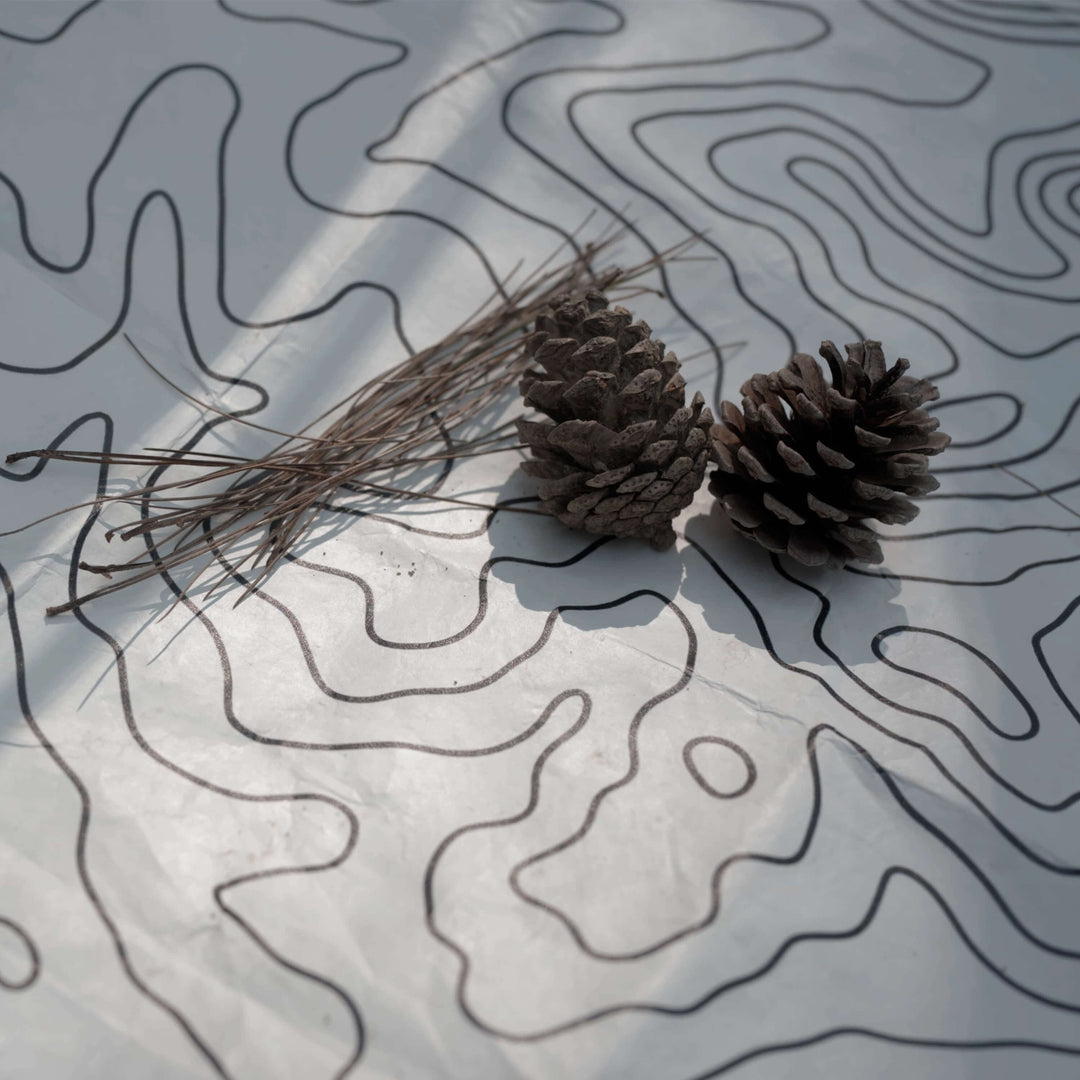 Tyvek vestibule mat with topographic pattern, pine cones & needles - HODRGEAR ultralight gear