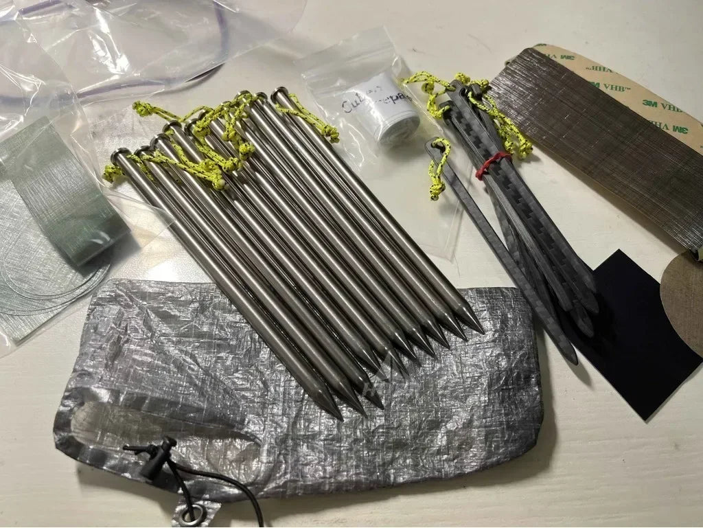 DCF peg sack laid flat beside folded pouch