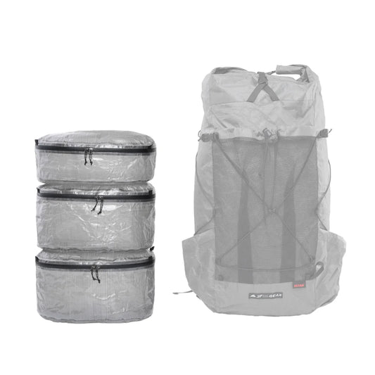 Set of gray Dyneema packing cubes and a backpack on a white background