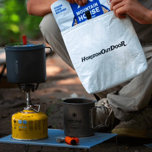 HODRGEAR white Tyvek insulated pouch holding food near ultralight camping setup