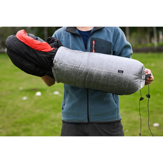 Full Dyneema compression sack holding sleeping bag, ultralight gear demo